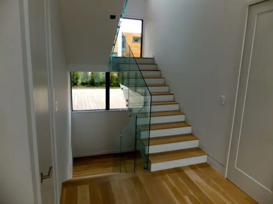 Classic staircase with modern glass railing