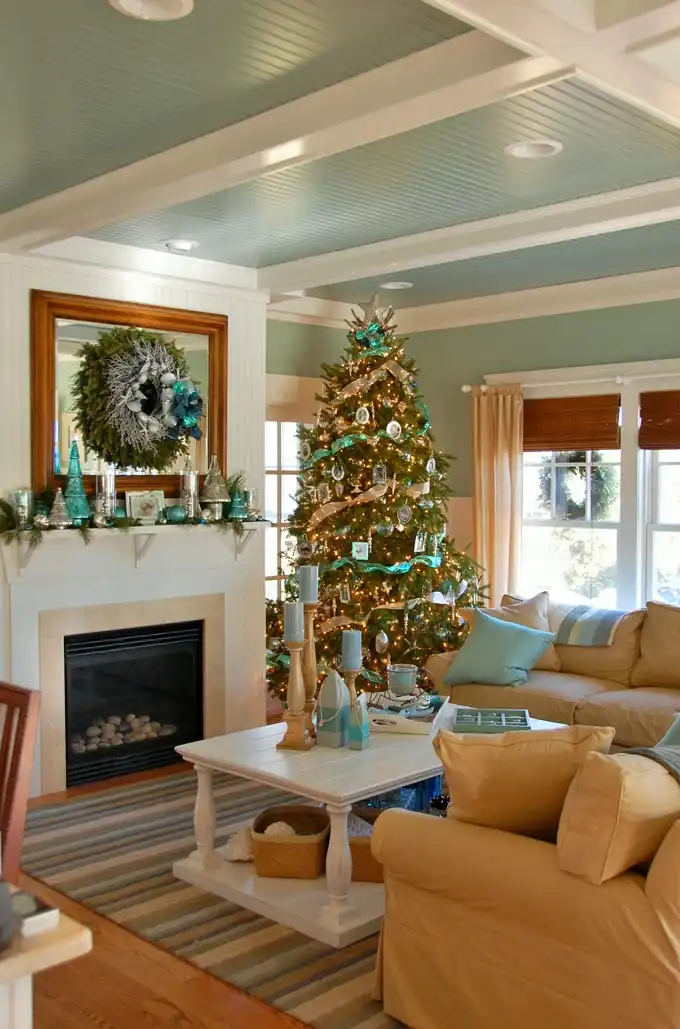 Coastal Christmas tree decor and wreath above mantel