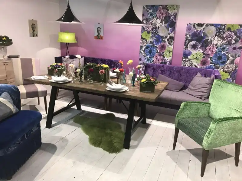 Colorful dining area with bench and cool armchairs