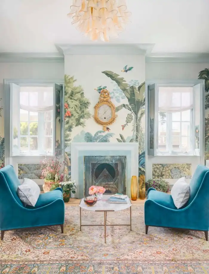 Colorful room with blue armchairs and fireplace
