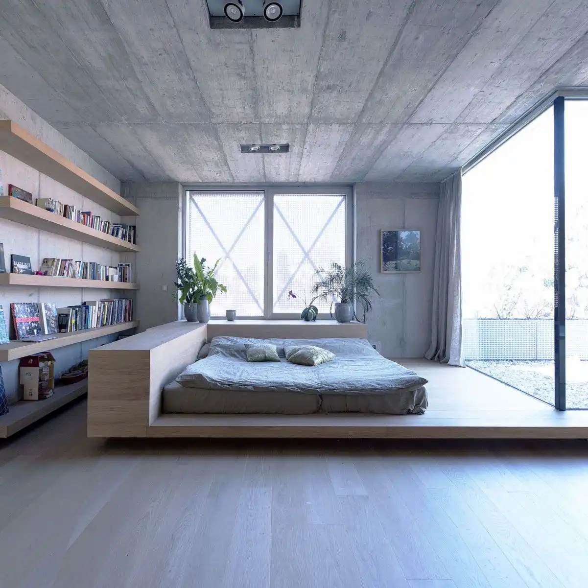 Concrete OFIS Architects Home Library behid bed