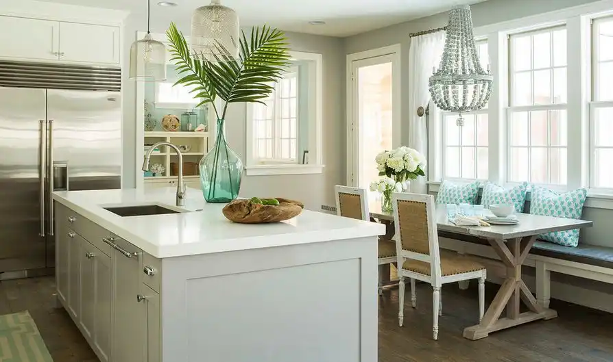 Corner bench in kitchen with beaded chandelier for light