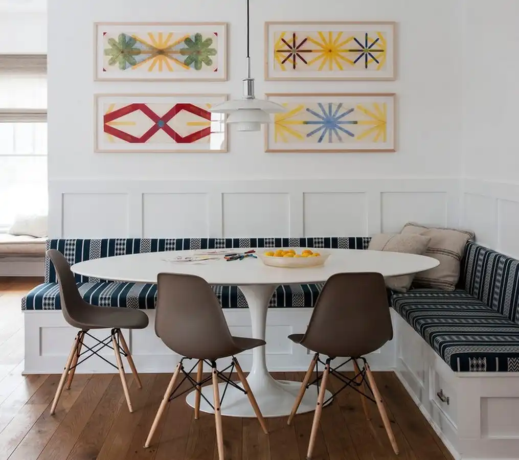 Corner bench seating with Saarinen tulip table and Eames chairs