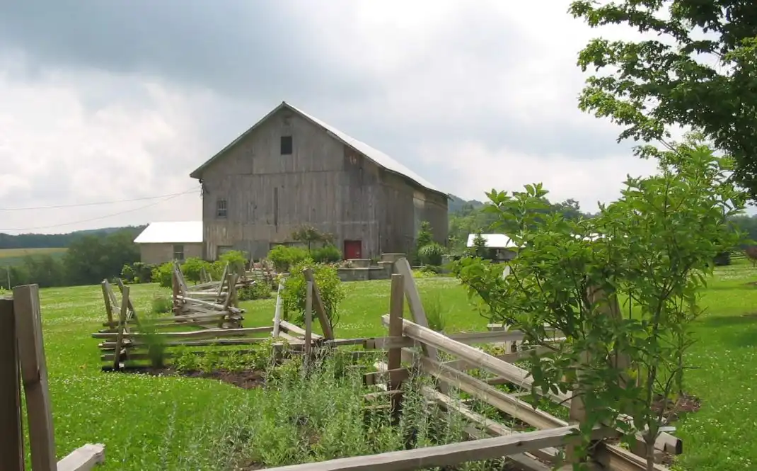 Country farmhouse with big split rail fence