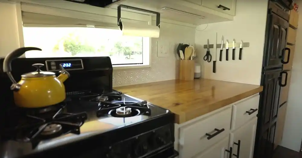 Couples DIY School Bus Conversion kitchen