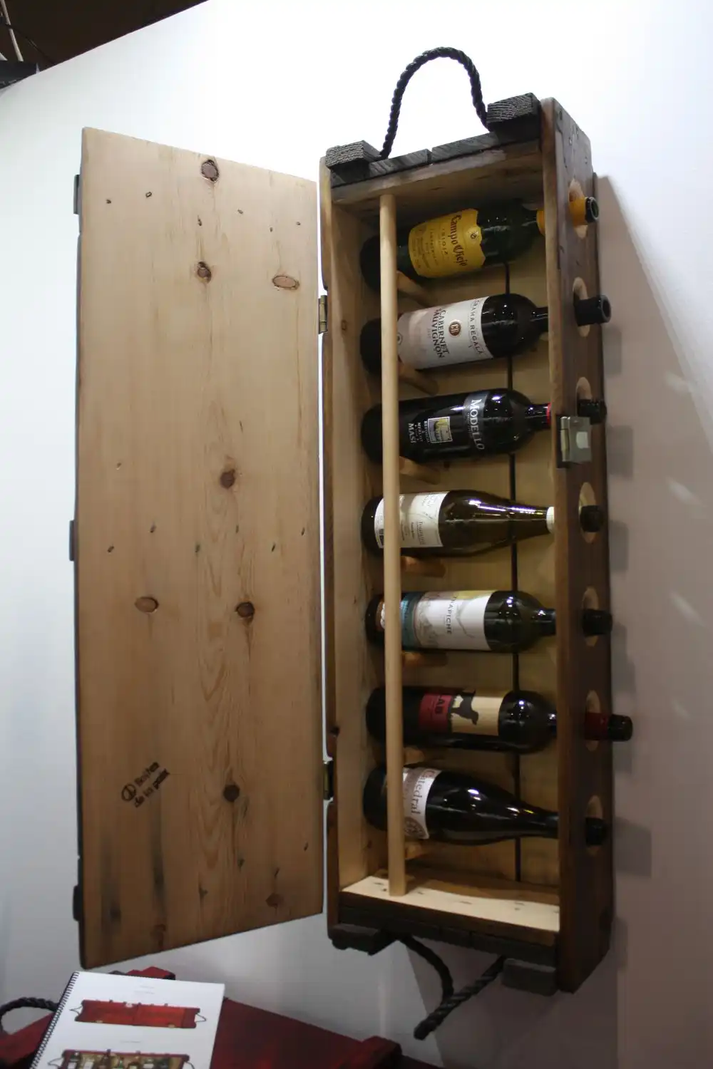 Create a wine wall rack from an old box