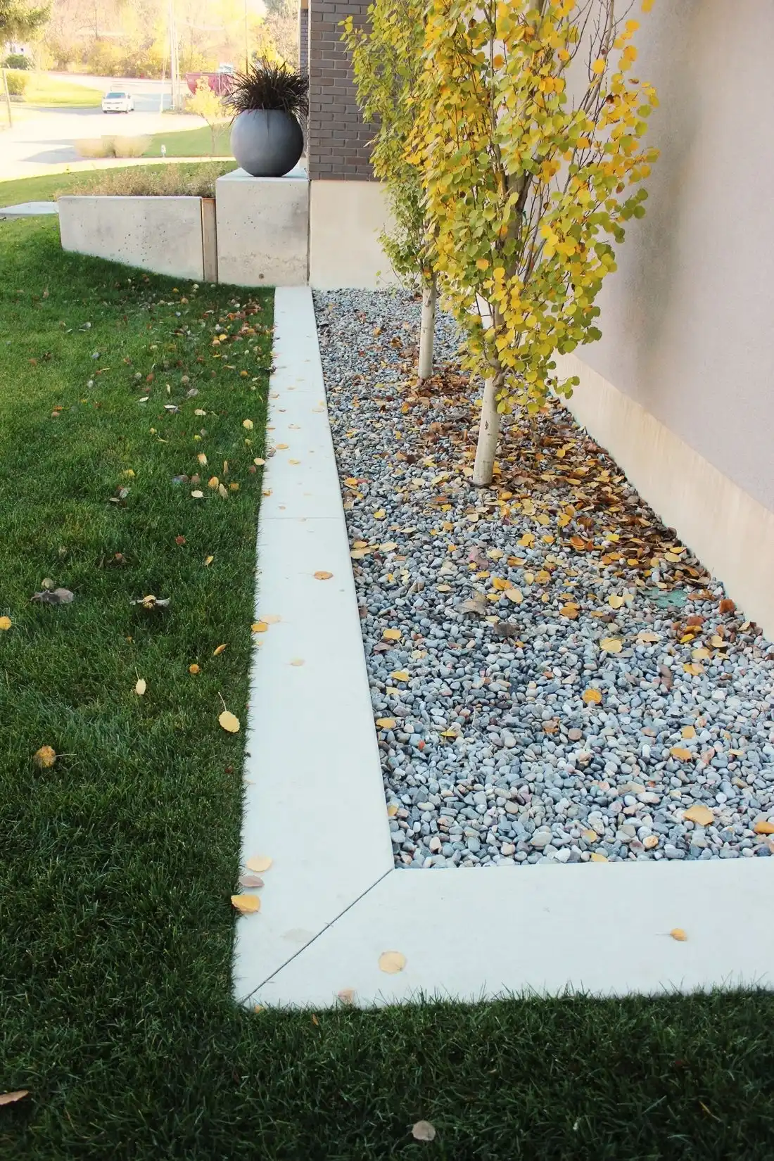 Curb Appeal - landscaping is clean-lined and custom
