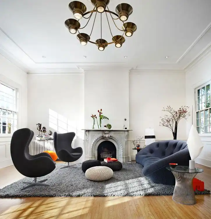Curved blue sofa and egg inspired armchairs