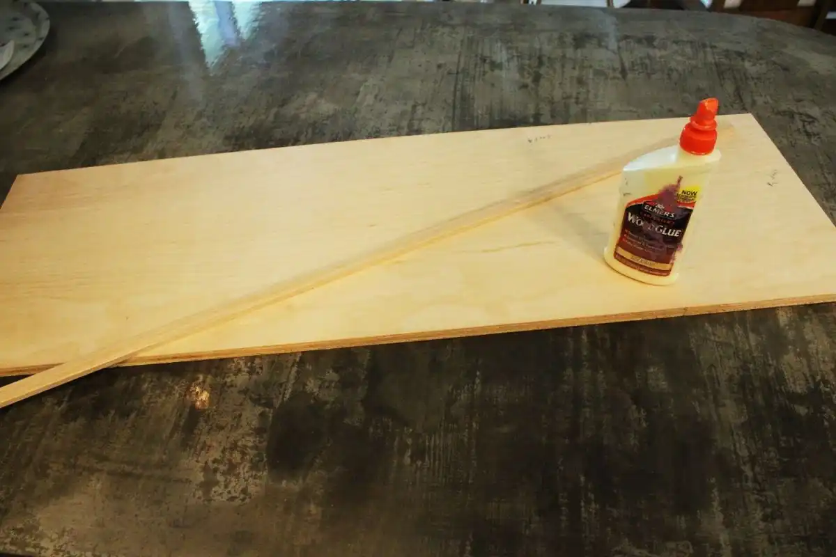 Cut a piece of wood or plywood