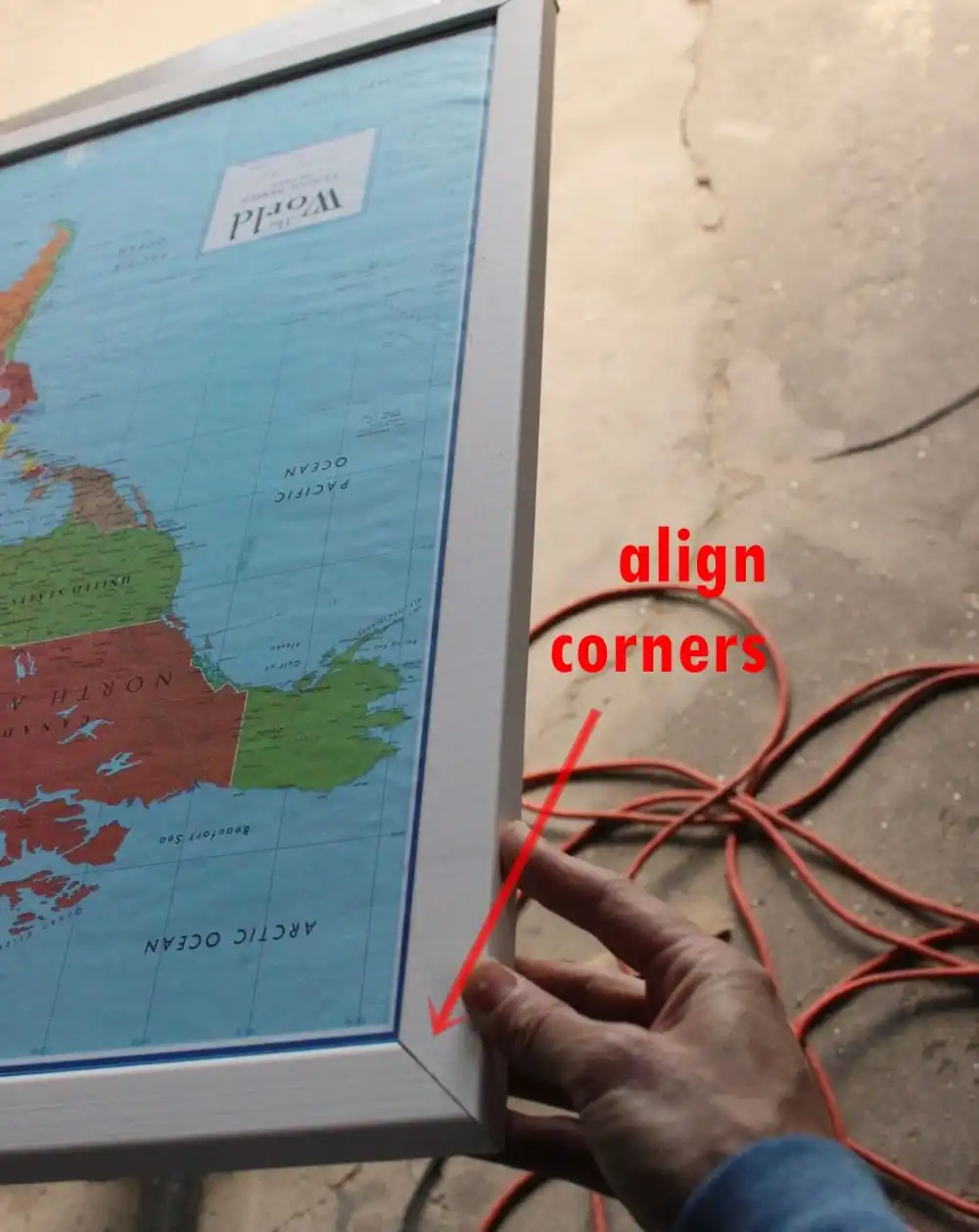 DIY Framed Map Corkboard - top trim piece nailed