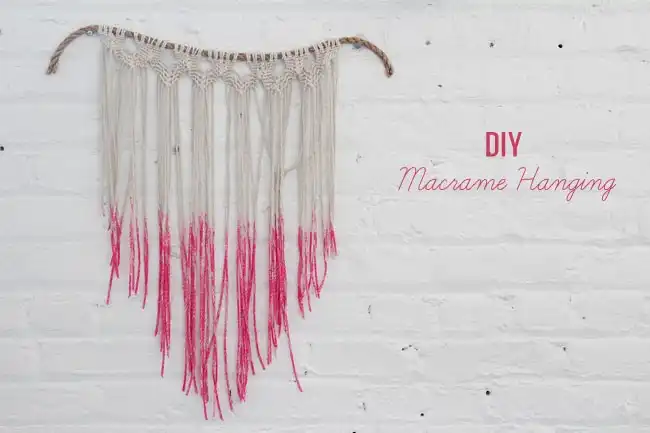pink and white macrame wall hanging
