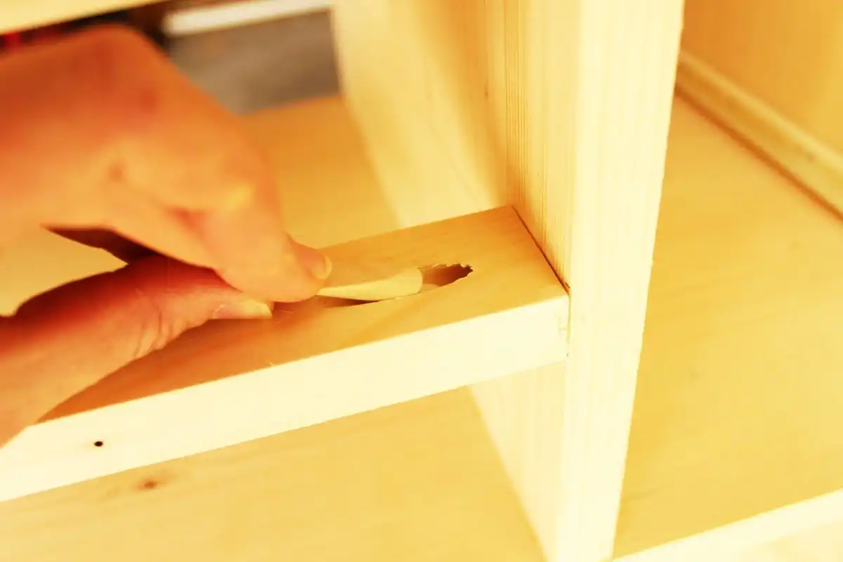 DIY Modern Wooden Dresser Slide the pocket hole plug into the hole
