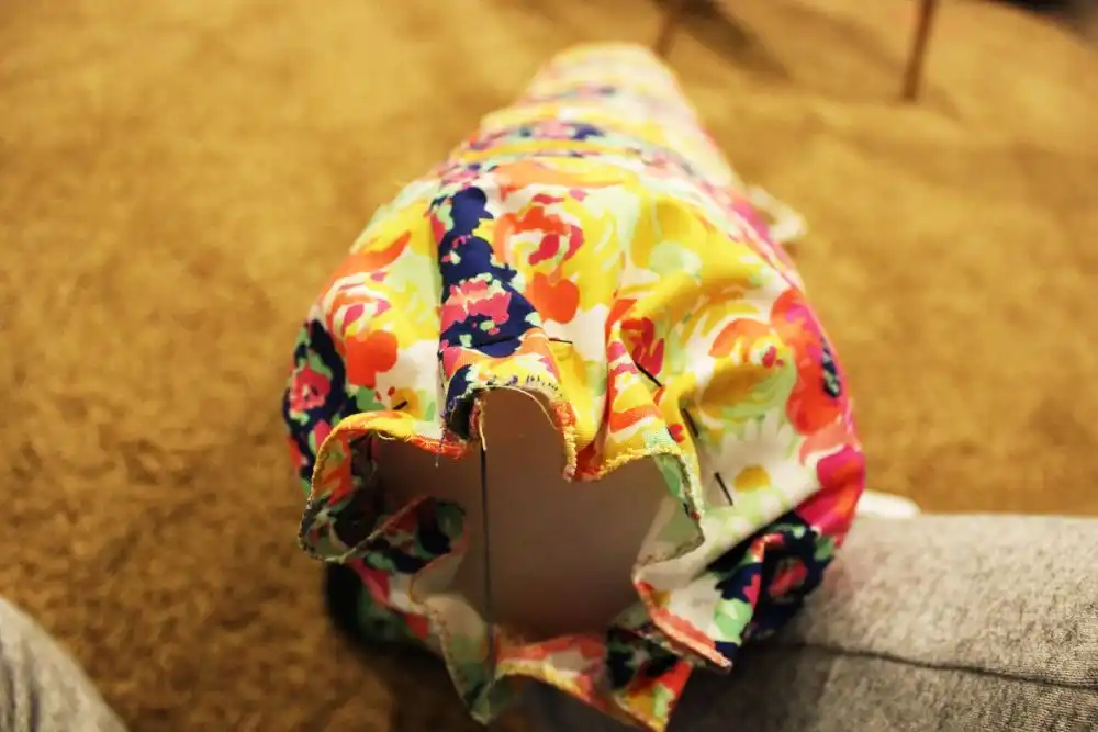DIY Sew a Bolster Pillow Carefully pull the thread so the fabric