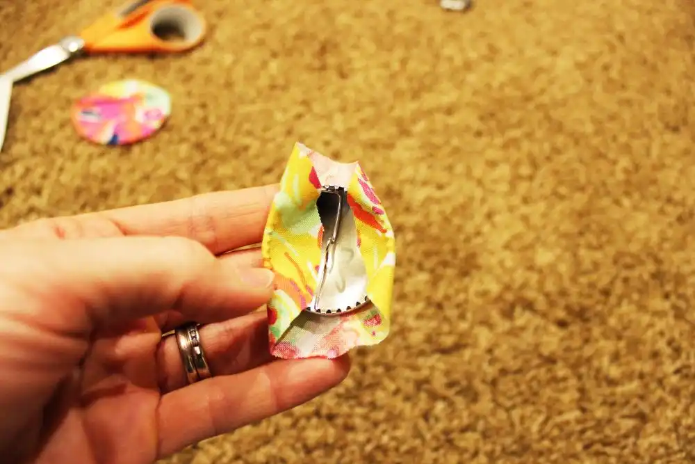DIY Sew a Bolster Pillow Fold over fabric on opposite sides of your button