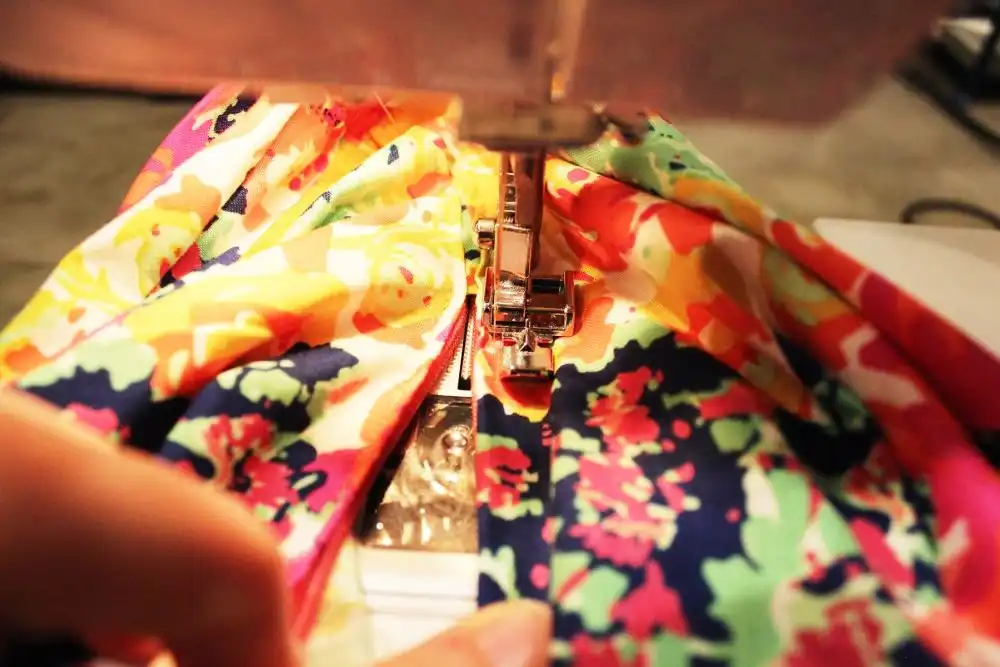 DIY Sew a Bolster Pillow slide the fabric underneath your zipper foot