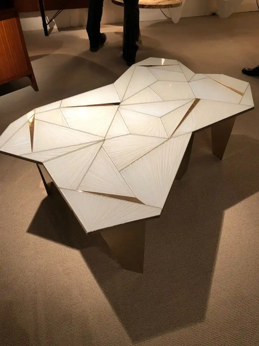 The glass and irregular shapes come together in an very intriguing table.