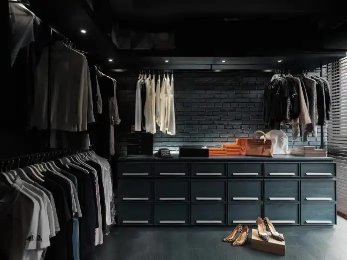 Dark masculine walk in closet design