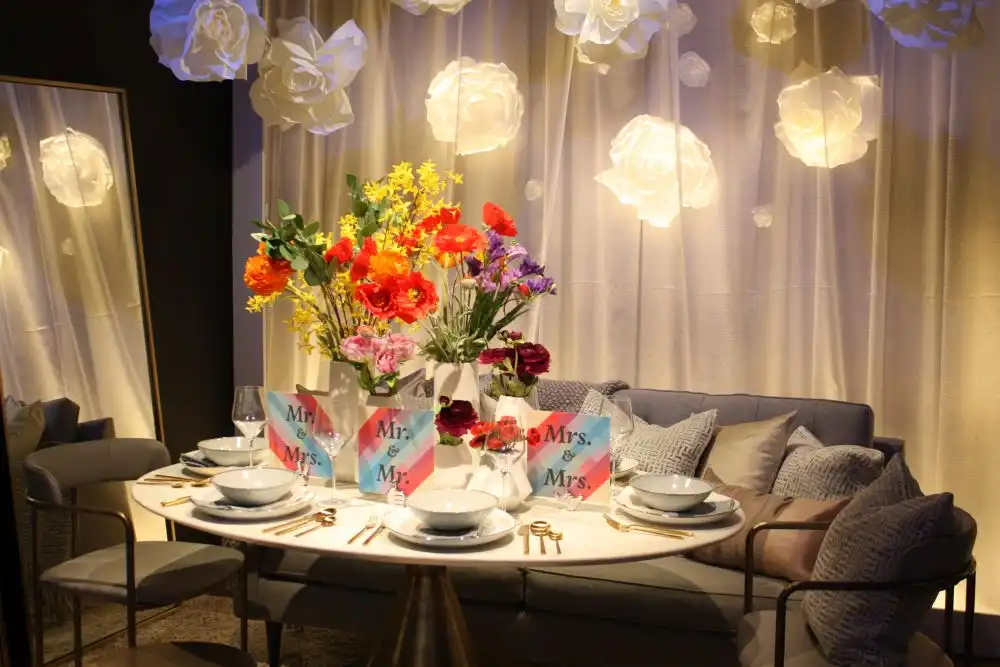 Decorating a small table with dishes and fresh flowers