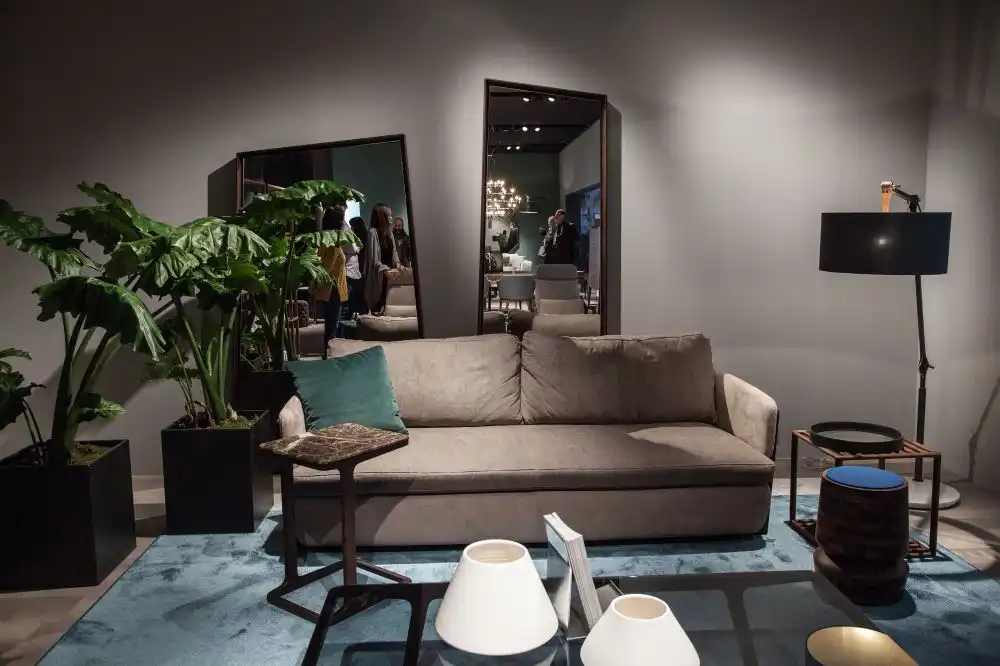 Decorating the wall behind the sofa with dramatic mirrors