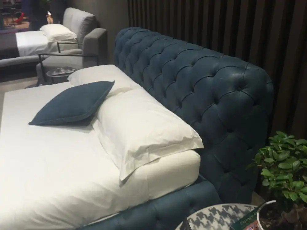 Deep blue tufted bedroom headboard