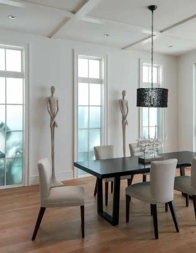 A minimalist interior is the perfect backdrop for dramatic statues.