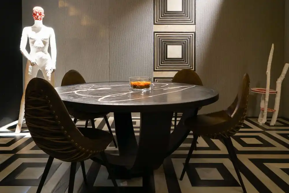 The geometric print on the rug coordinates with the wall decor
