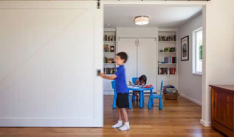 Divide a playroom from living with a sliding barn door