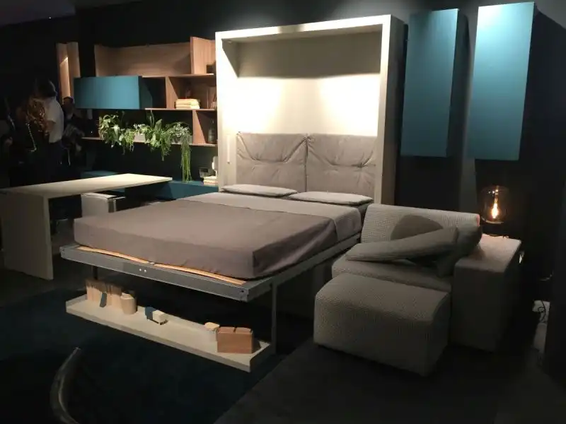 Drop down bed from wall for small spaces