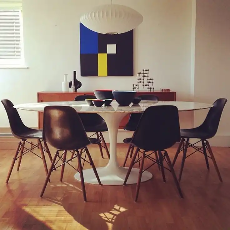 Eames molding chairs with Tulip table design