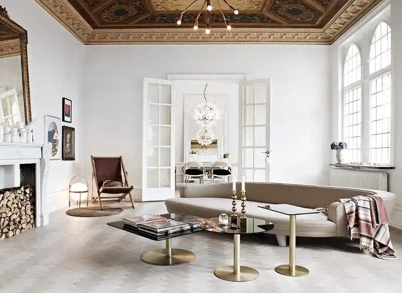 Elegant living room design with gold based coffee tables