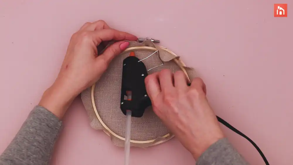 Glue the fabric trim to the hoop
