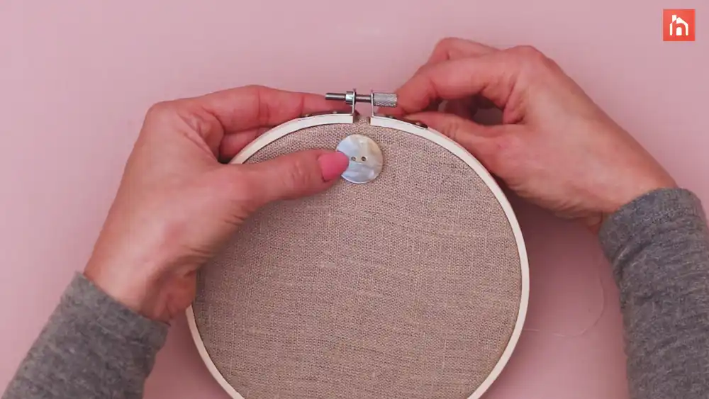 Sew on the large buttons