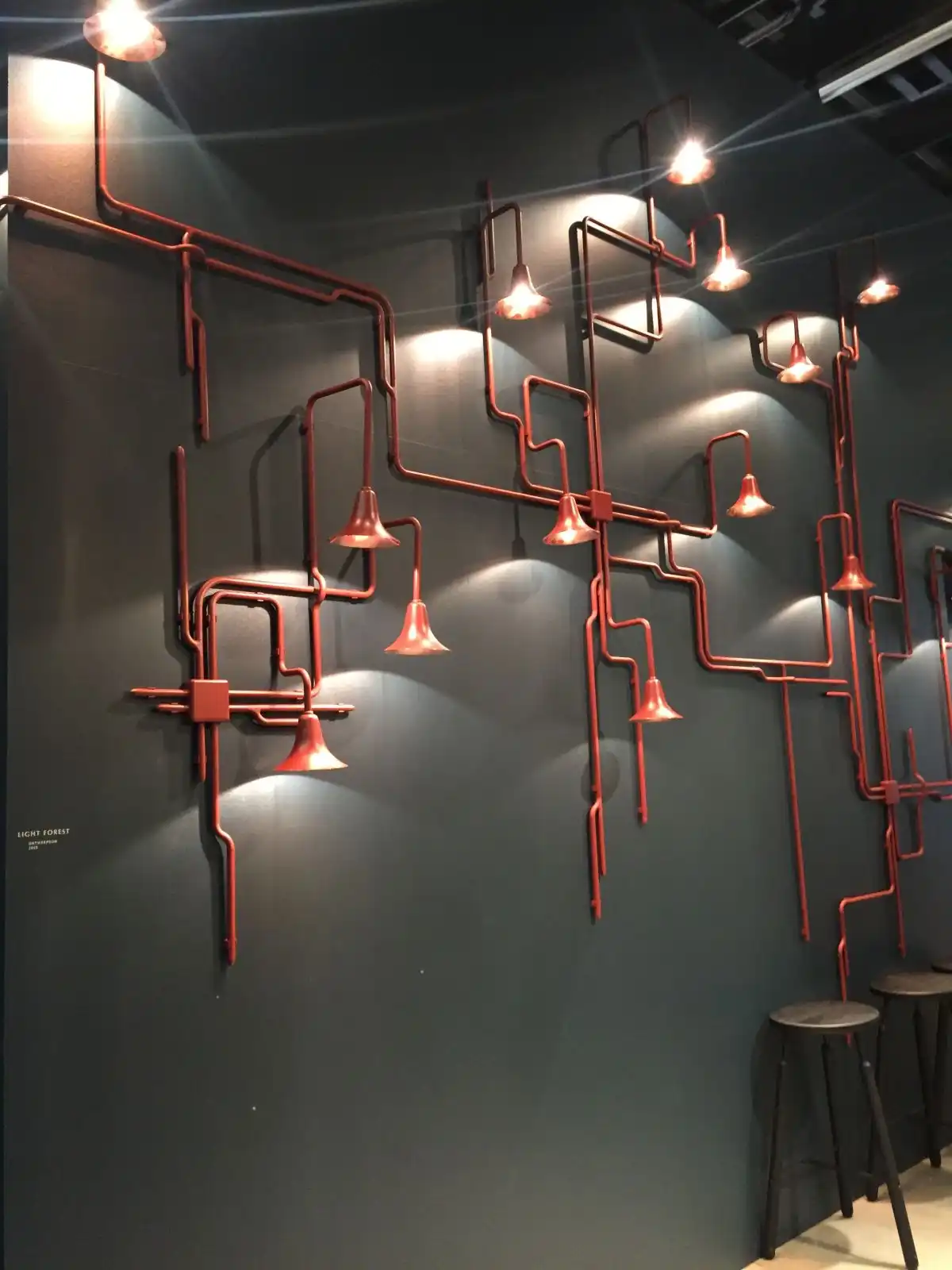 Exposed pipes turned into lighting fixtures