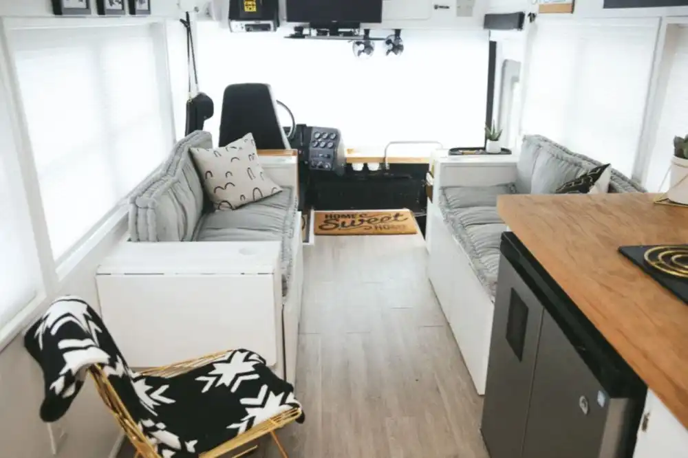 FAMILY OF 6 LIVING FULL TIME IN A 250 SQFT CONVERTED SCHOOL BUS driver seat