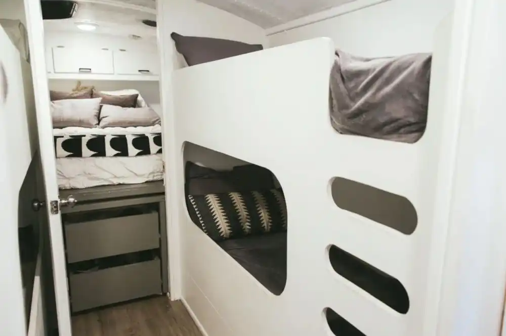 FAMILY OF 6 LIVING FULL TIME IN A 250 SQFT CONVERTED SCHOOL BUS kids room