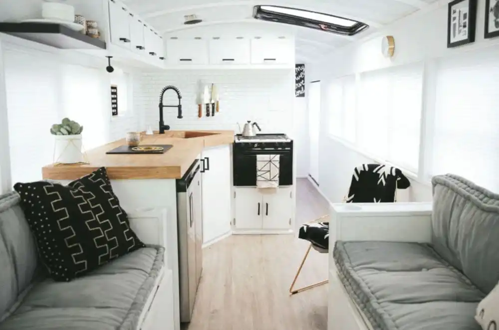 FAMILY OF 6 LIVING FULL TIME IN A 250 SQFT CONVERTED SCHOOL BUS kitchen