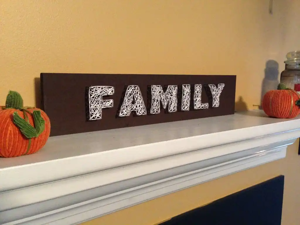Fireplace mantel string family art