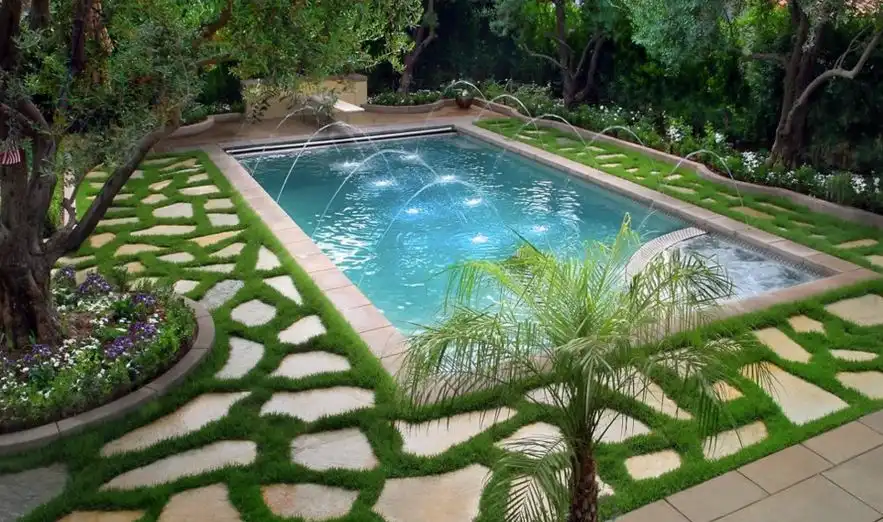 Use flagstone around the pool and highlight the geometry with grass