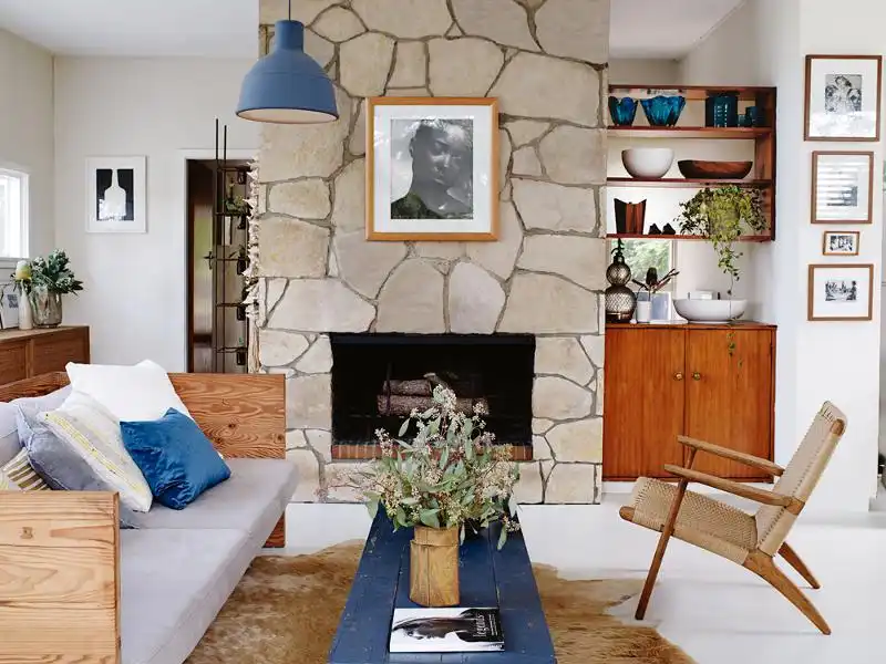 Framed portrait on a stone fireplace