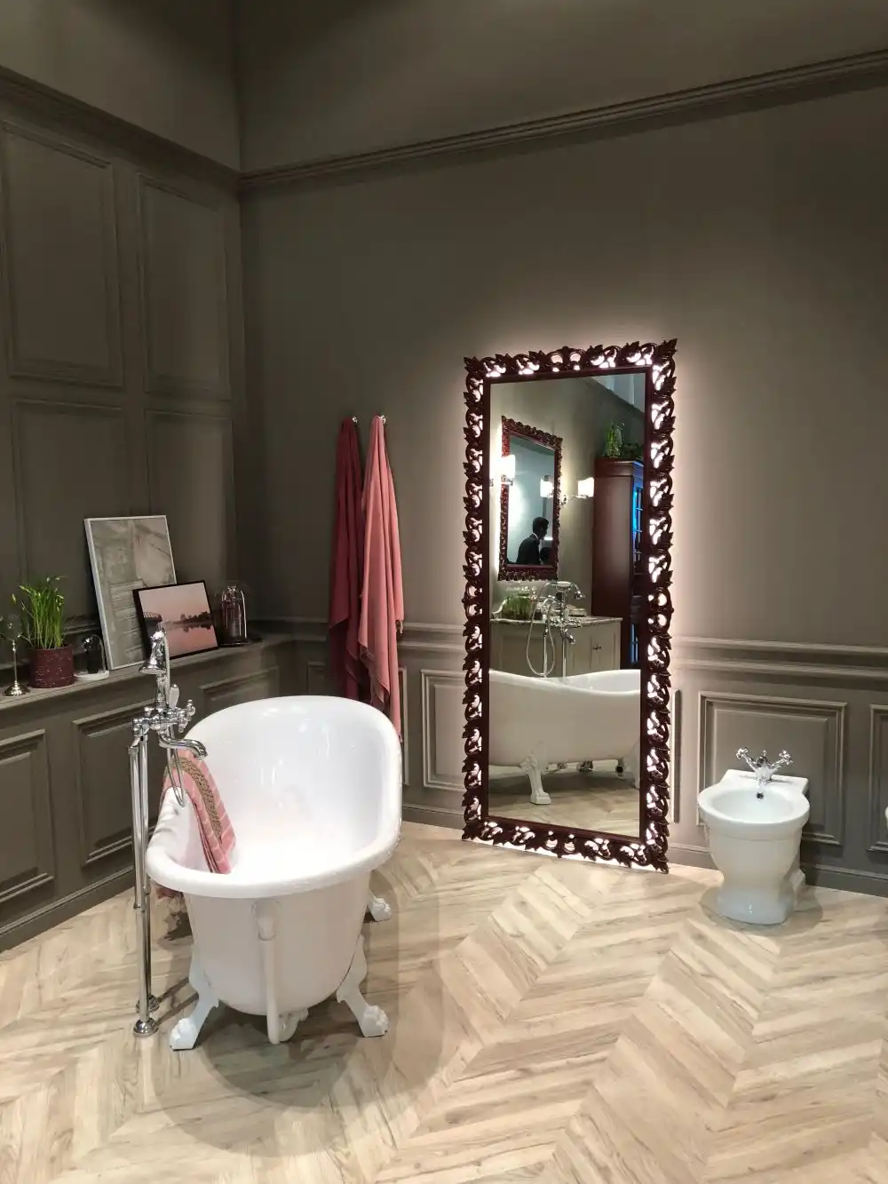 Freestanding tub and floor mirror gray bathroom
