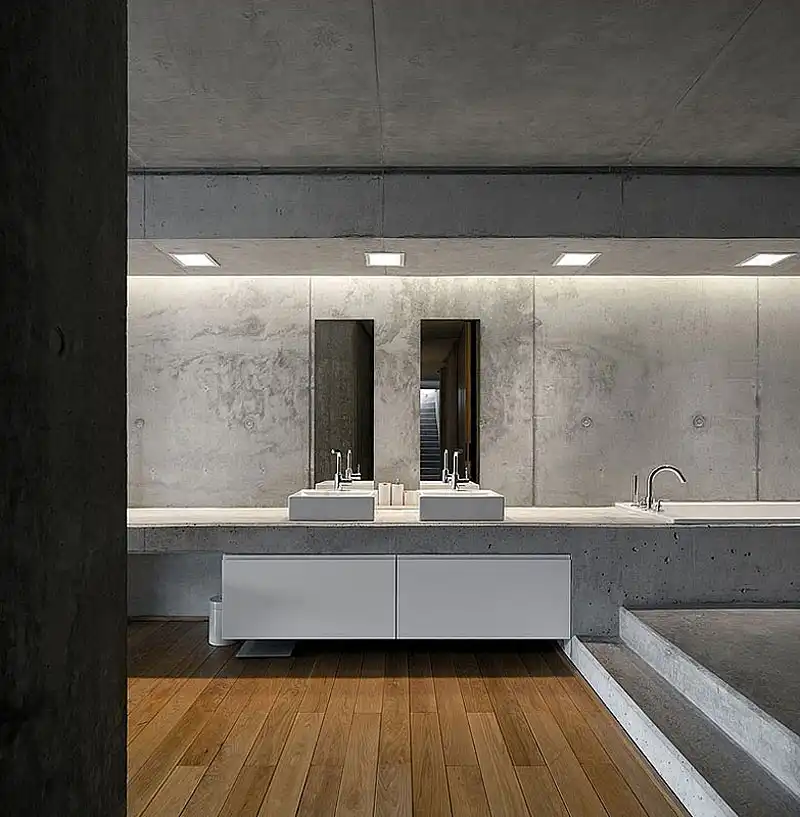 Full concrete bathroom design with wooden floor