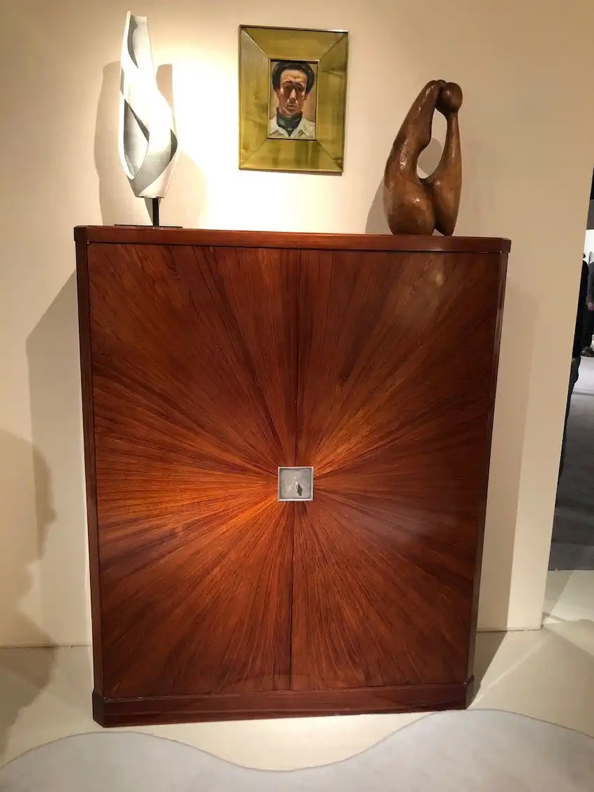 Masterful woodwork is common in custom pieces of the era.