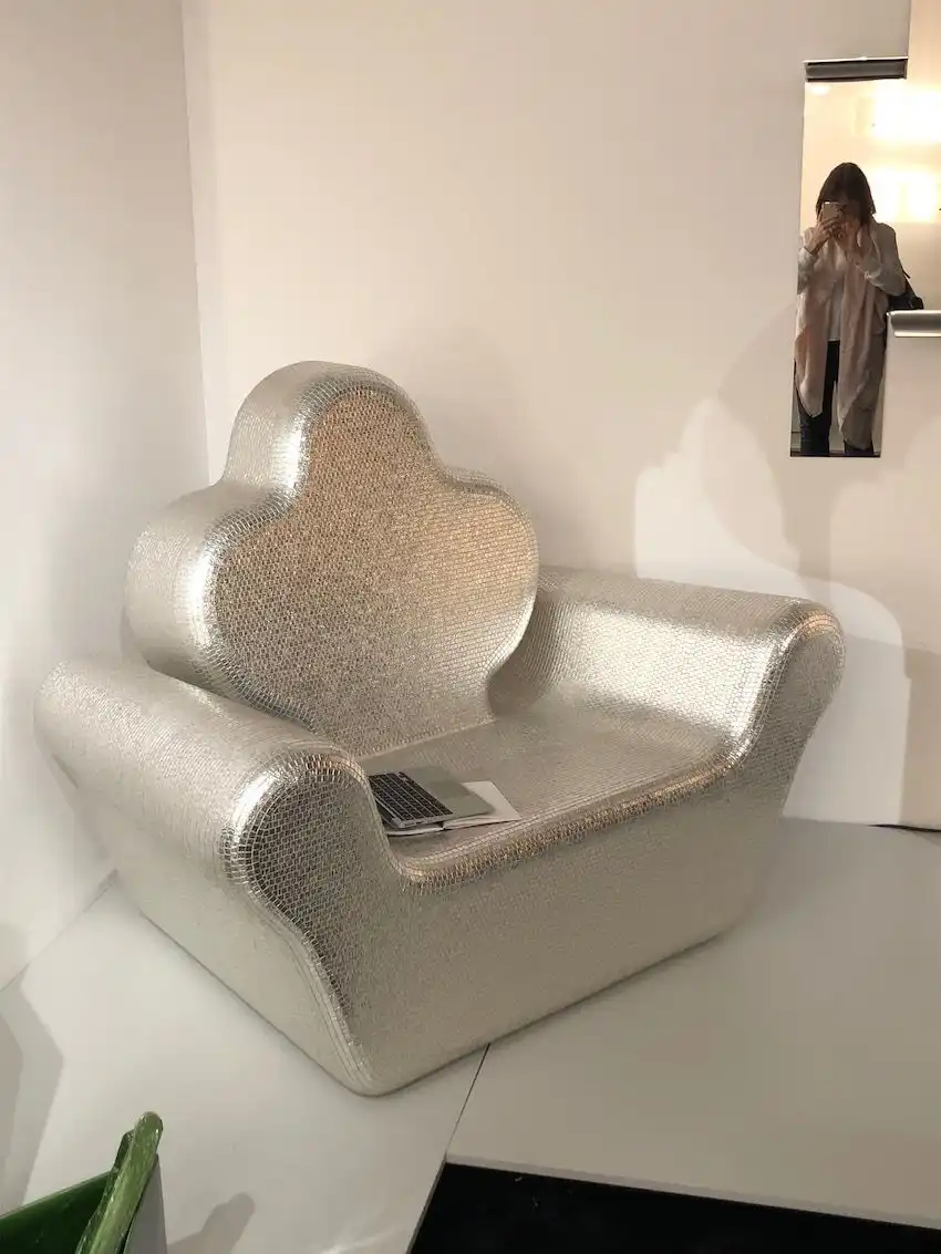 The glittering mosaic finish adds to the regal feel of this chair.
