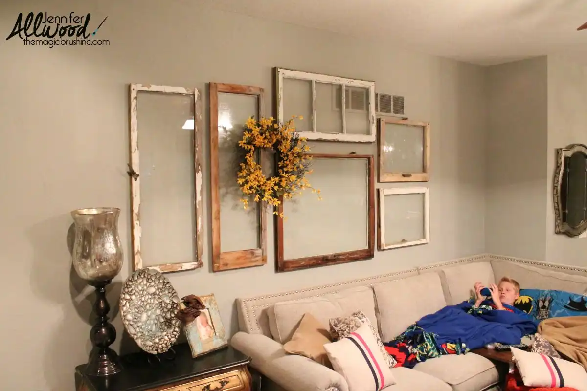 Gallery above the sofa from old windows
