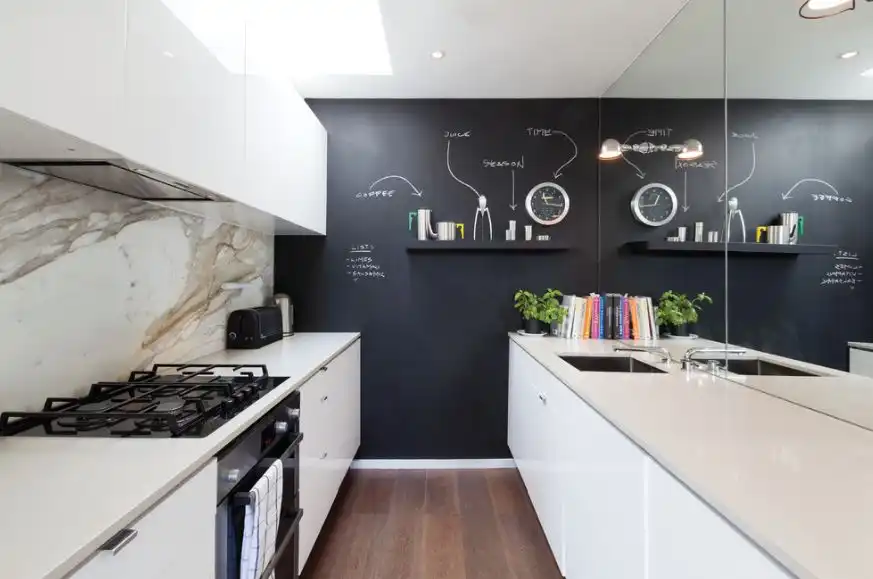 Gallery kitchen with chalkboard wall