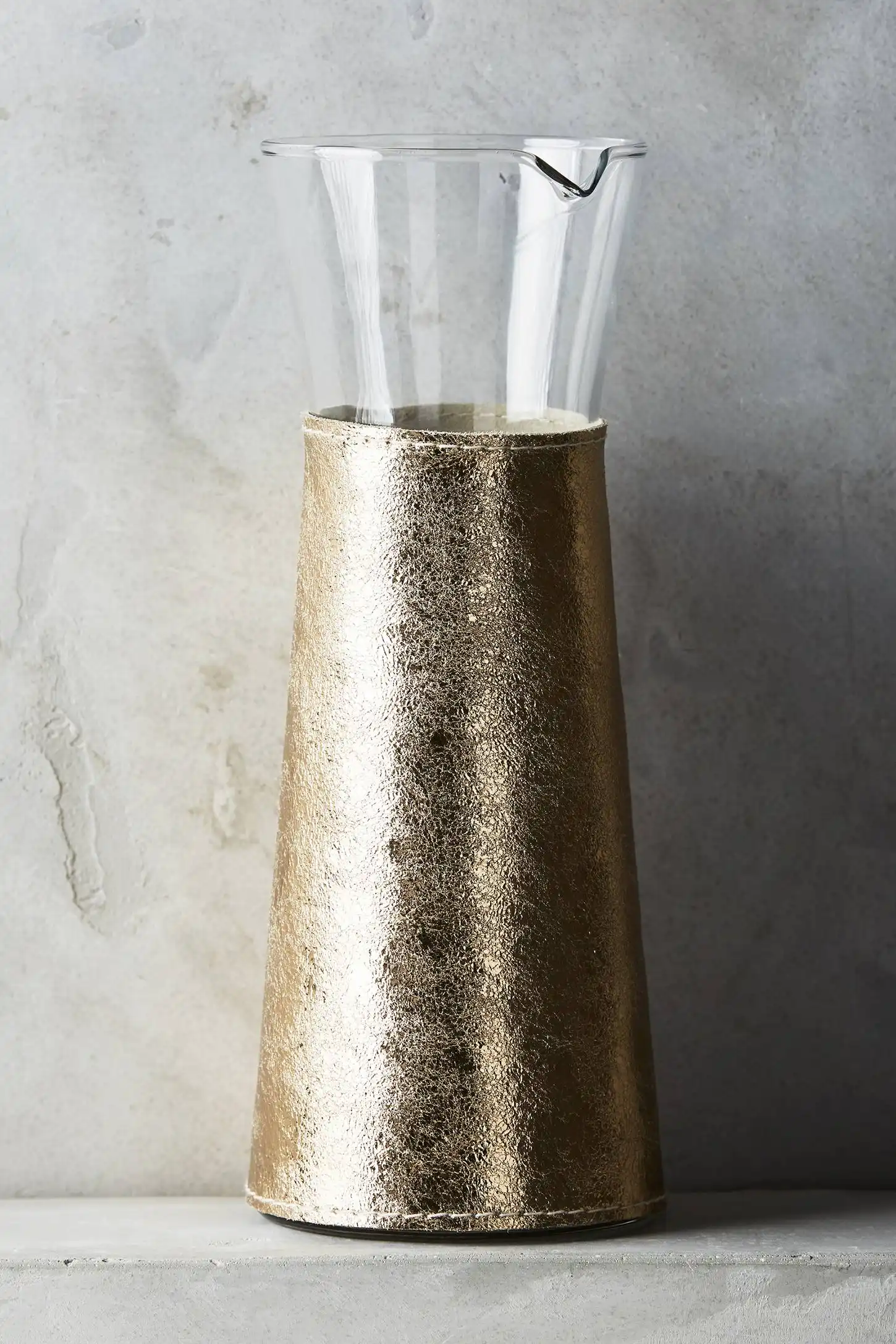 Gilded leather carafe