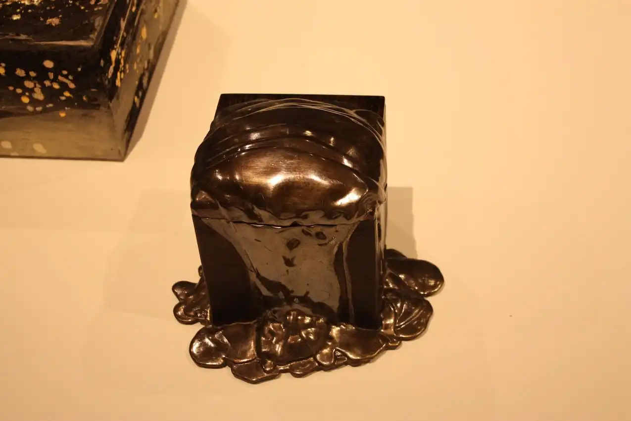 More than just a box, the melted design of this piece makes the a truly artful accessory.