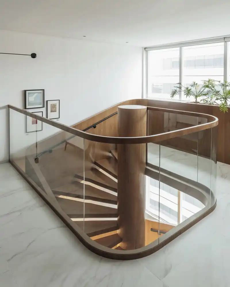 Glass balustrade with wood handrail