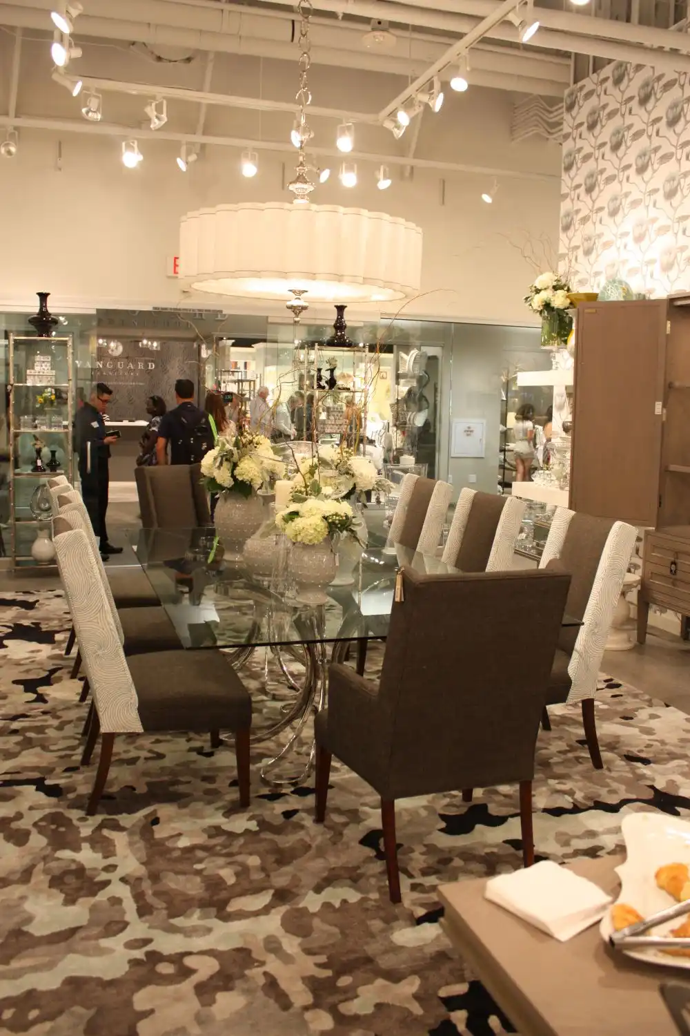 Glass dining table top decorated with flower vases