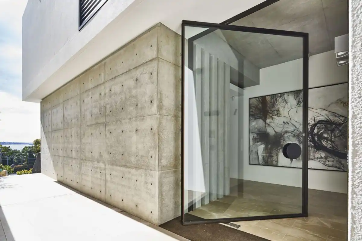 Glass doors that pivot help fuse the outdoors with the indoors.